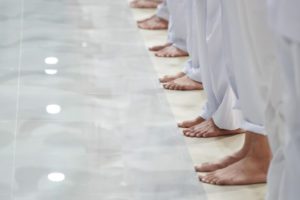 asian-men-feet-are-standing-row-with-all-white-trousers_39476-1736 Why Do Asians Remain Barefoot Most Times?